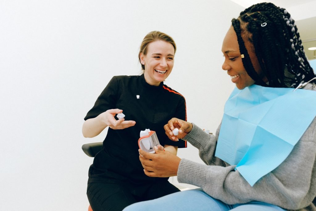 Dental assistant with patient